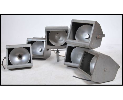 A collection of 6 vintage mid century Industrial theatre / cinema lights by Strand. Each with wall mount brackets and shades 