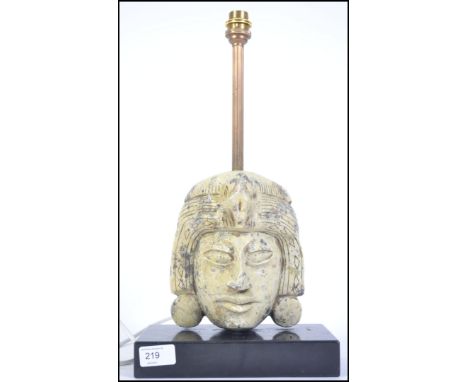 A 20th century marble South American tribal mask table lamp. The mask with frog to head being a sign of fertility. Raised ove