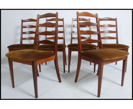 A set of six retro 1970's G Plan teak dining chairs with ladder back solid teak design a original ' old gold ' seat coverings