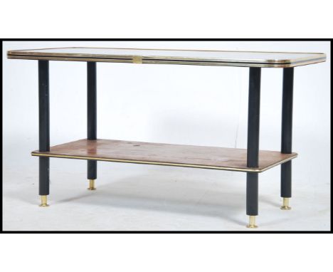 A vintage 1950's retro coffee table of rectangular form having inset backgammon style top raised on turned ebonised supports.