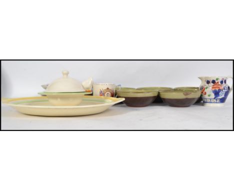 A collection of ceramics to include Deco meat platter, a set of Winchcombe pottery bowls, Carlton Ware lidded dish and tureen