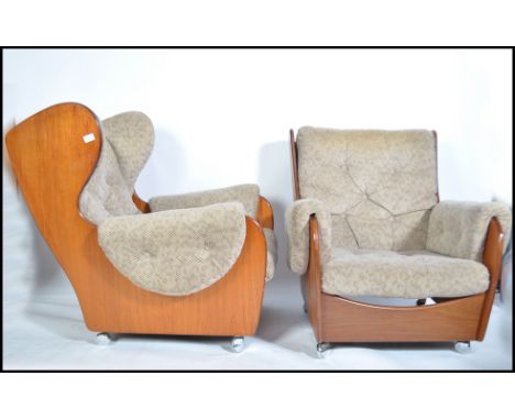 A Kofod Larsen for G-Plan vintage pair of 20th century retro teak framed  ' saddle ' armchairs having good shape teak wood fr