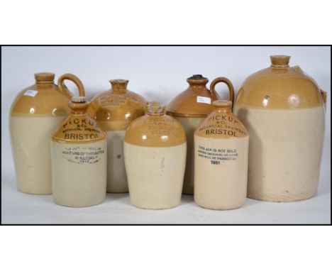 A group of seven early 20th century glazed ceramic stone ware beer / cider flagons of mostly Bristol interest.  To include fl