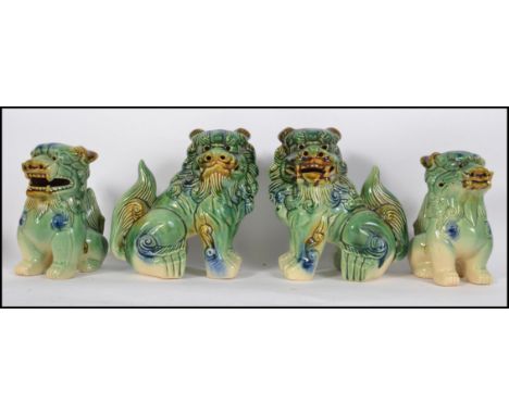 Two pairs of mid 20th century ceramic dogs of fu  - fu-dogs having been purchased by the vendor 45 years ago in Singapore.  E