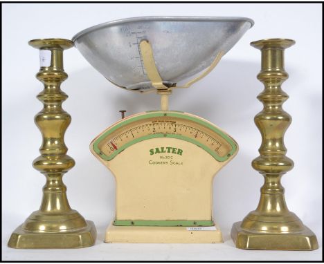 A vintage mid century retro Salter Cookery Scale No 30C with bowl together with a pair of Victorian brass pusher candlesticks