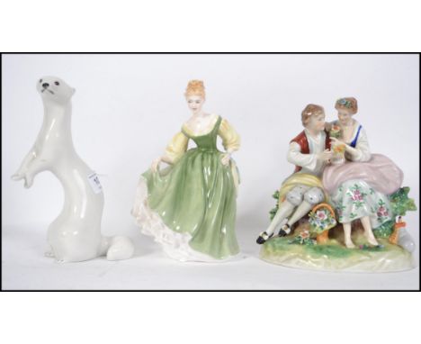 A retro mid century USSR figurine of an Otter together with a Royal Doulton Fair Lady HN2193 along with a Foreign Meissen typ