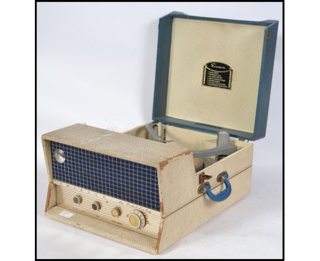 A 1960's portable Emerson Hi Fidelity  four speed two tone record player. Hinged lid lifting to reveal a four speed automatic