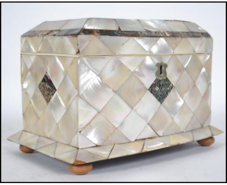 A mid Victorian mother of pearl and abalone shell tea caddy of rectangular form, the lid incorporating abalone shell border o