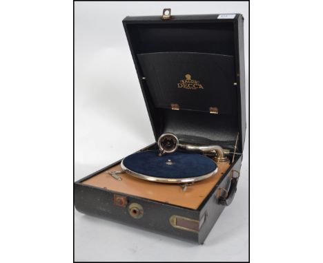 A vintage Decca Salon portable wind up picnic gramophone, with carry handle to the side having an Ostrich skin style vinyl co