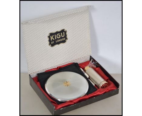 A good white metal vintage 1950's Kigu of London ladies compact and atomiser perfume spray. The set complete with the miniatu