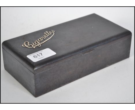 A vintage 20th century cigarette box constructed from blue steel having an applied motif for cigarettes in hallmarked silver.