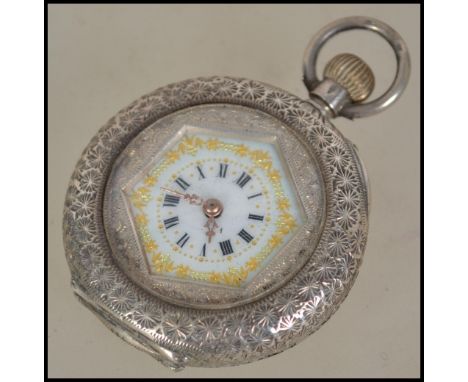 A silver 935 ladies fob watch with decorative enamel dial. The rococo case having open dial with crown winder. Total weight 3