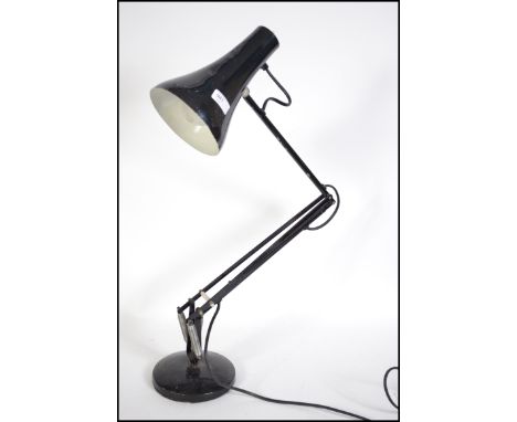 A vintage Herbert Terry post war anglepoise desk lamp in original black paint. Circular terraced base with pendant shade.  