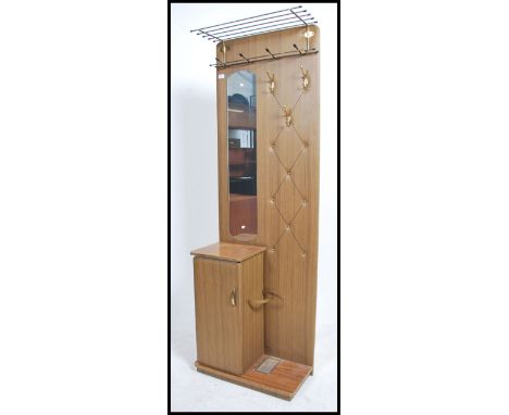 A vintage retro 1960's vinyl upholstered hall stand unit with integrated atomic shaped mirror upper hanging rack with brass o