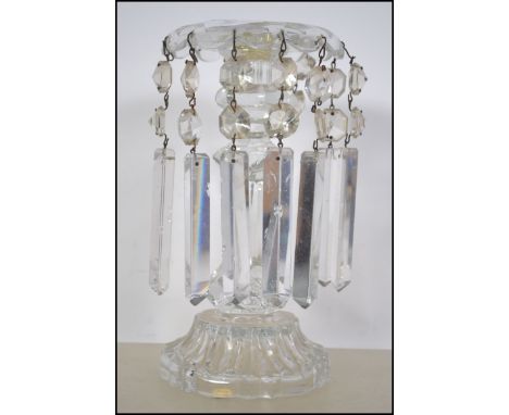A stunning early 20th century table glass lustre having long glass faceted droplets under three branch lamp above together wi