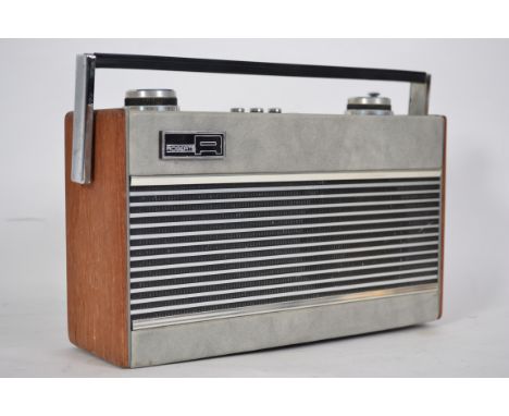 A vintage 1970's Roberts portable Radio .Model No R25 having teak and grey vinyl case. Battery and mains adaptor