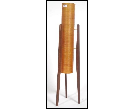 A retro 1960's teak and spun resin rocket floorstanding lamp, the orange cylindrical centre flanked by three worked timber su