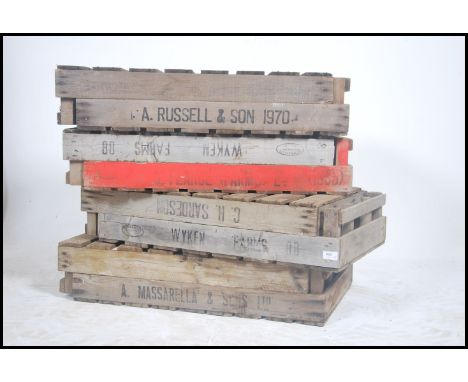 A stack of vintage Industrial apple crates. Wooden planked form with remains of paint and notation to some ( see illustration