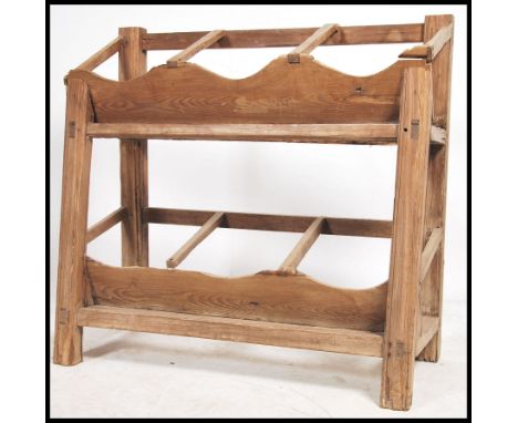A rustic 19th century pine keg tray stand - agricultural stand raised on block legs and stretchers with angular section atop 