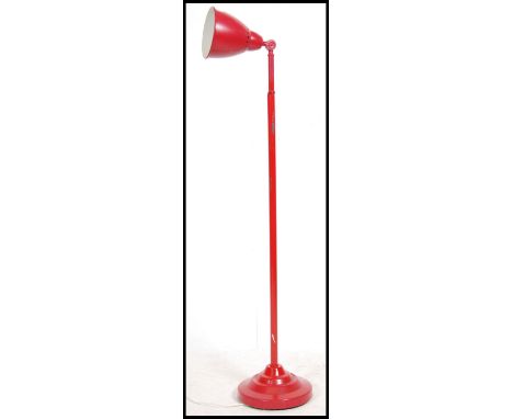A Herbert Terry anglepoise desk lamp raised on terraced base together with a contemporary red floor anglepoise lamp. Measures