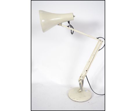 A 20th century retro Herbert Terry Anglepoise desk lamp having a circular base with conical shade in original white paint fin