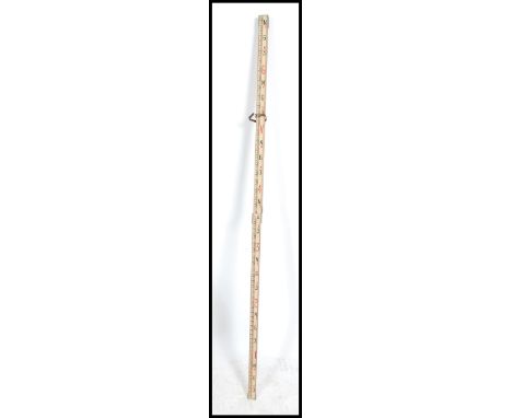 A superb vintage Industrial architects original tri-fold metamorphic measuring stick  having baton measures to one side with 