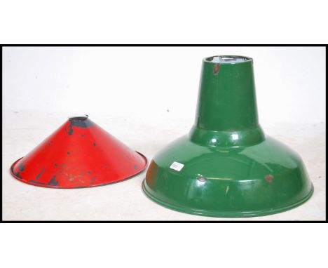 A vintage Industrial factory ceiling pendant light fixture having a green enamel finish together with an industrial shade wit
