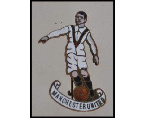 A rare 1920's enamel pin badge for Manchester United. In the form of a footballer having mark to back ' Foreign Made ' The ki