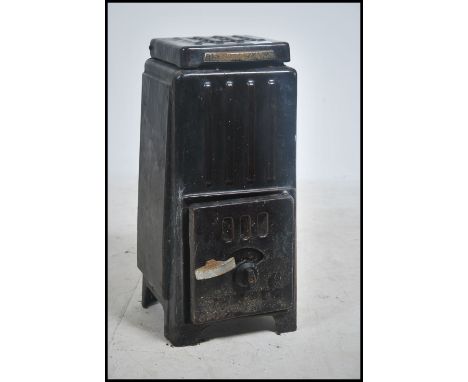 A small early 20th century French enamel Art Deco woodburning stove - coal burning. Of small pedestal form with burgandy brow