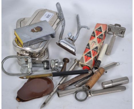 A collection of items to include Rolls Razors, vesta, hair clippers, a fantastic lighter in the form of a truncheon, button h