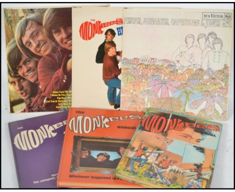 Three vinyl long play LP records by The Monkees to include The Monkees, Headquarters and Pisces Aquarius Capricorn and Jones 