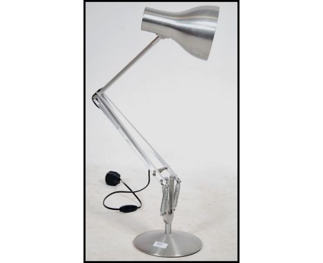 A contemporary polished steel desk lamp by Anglepoise lamp Co. Raised on a circular base having a pendant shade and marked to
