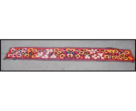 A stunning large Chinese / Asiatic hand sewn quilt work tapestry wall hanging depicting birds and fauna on red ground.