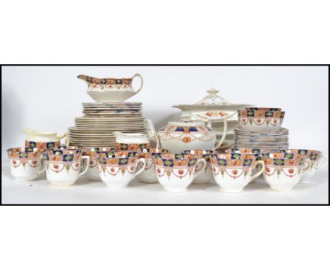 A 20th century Imari pattern Staffordshire part dinner and  tea service comprising teapot, sugar bowl , creamer,  cups, sauce