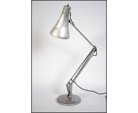 A polished metal post war  - 1950's stripped metal anglepoise Industrial desk lamp raised on a terraced base with pendant sha