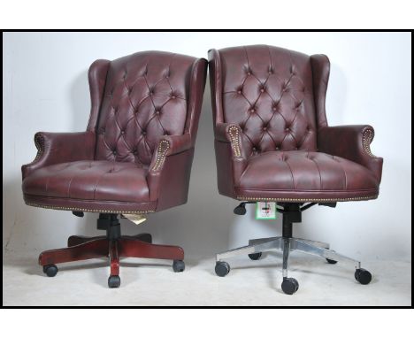 A pair of contemporary antique style Chesterfield Style mahogany and ox-blood leather button back captains office swivel chai