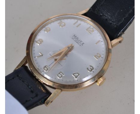 A vintage 1960's gentleman's wristwatch set to a black leather strap. The silvered dial with subsiduary seconds dial with fac