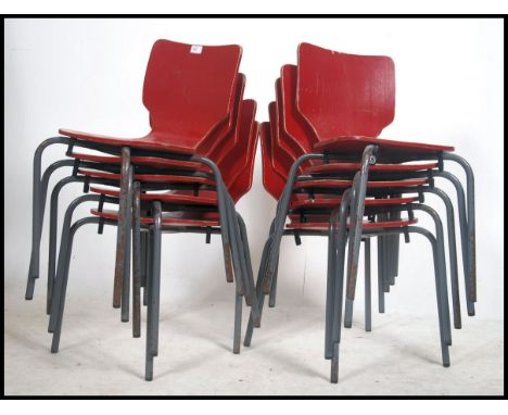 A set of 10 vintage childrens - school stacking chairs being raised on tubular metal fames with red painted one piece bentwoo
