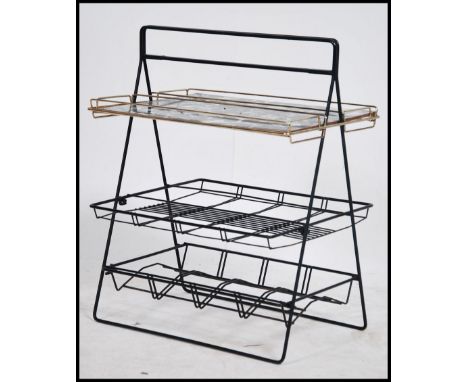 1950's retro drinks serving tray / magazine rack with carry handle.  This unusual item has a melamine top with a monochrome l