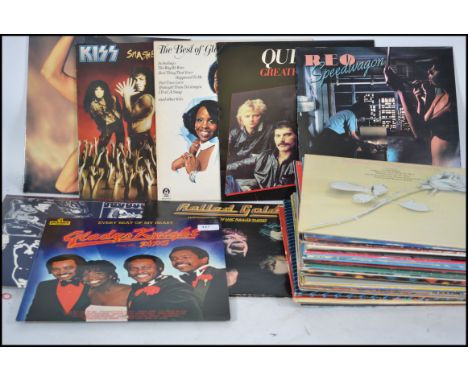 A collection of long play vinyl LP's records, to include The Rolling Stones, Reo Speedwagon, Queen, Gladys Knight, Kiss, Go W