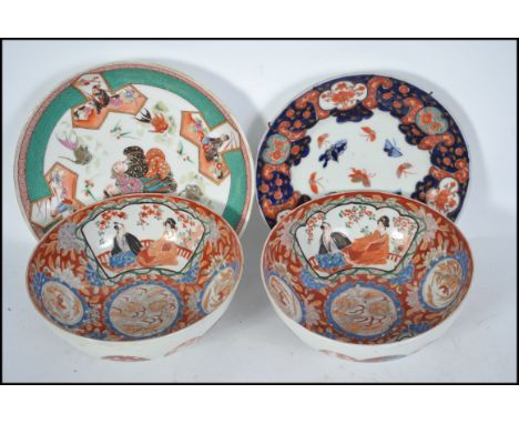 A pair of highly decorated Chinese Famille Rose porcelain ceramic bowls with patterned spheres to exterior and character mark