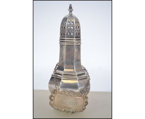 A silver hallmarked Sherry decanter label being hallmarked for Birmingham by Bishtons Ltd dating to 1976  weight 13.7g  toget