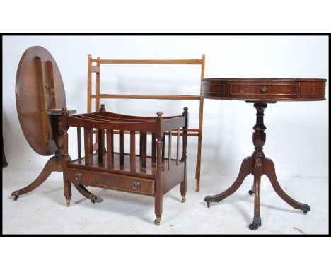 A Regency style mahogany drum table raised on turned tripod supports together with another single mahogany regency style side