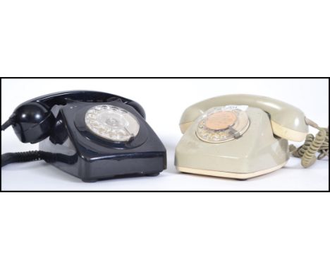 Two 20th century retro telephones one being a vintage BT model the other being a 1960s German model.