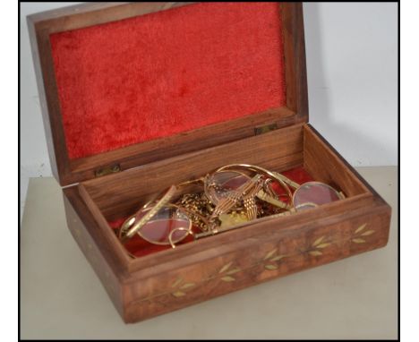 A collection of vintage gilt / gold plated jewellery to include necklaces, bracelets, puzzlers, two pairs of pince nez etc al