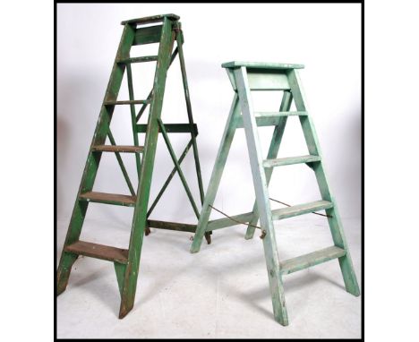 A vintage 20th century painted lattice worked Industrial step ladder. Ideal as conversion to bookcase shelf together with ano