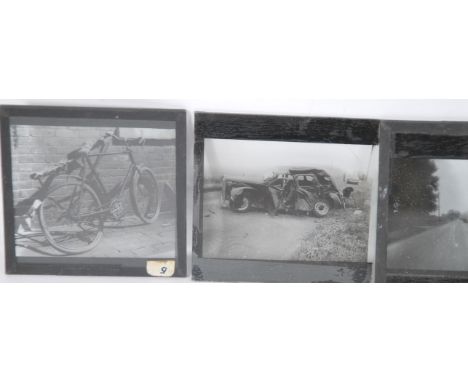 A small collection of magic lantern slides showing images of vehicle crashes to include cars and lorries, contained within a 