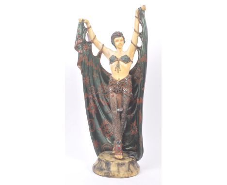 A large late 20th Century Art Deco style painted resin figure in the form of a dancing lady upon a marble effect base. The la