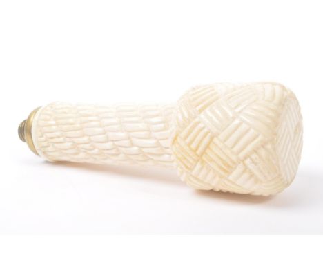A vintage 20th Century carved bone walking stick / cane handle of cylinder form with plaid decoration to head and brass screw