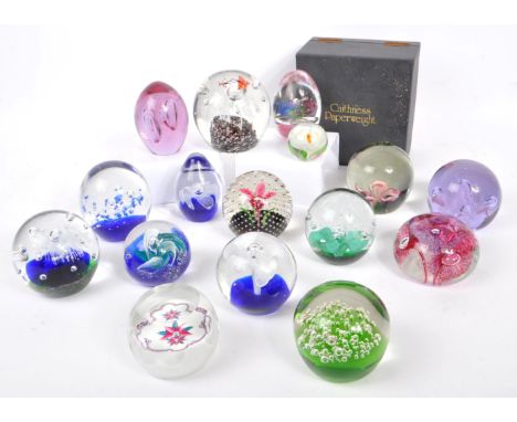 A large collection of assorted mid century / vintage studio art glass paperweights. Comprising of multi coloured controlled b